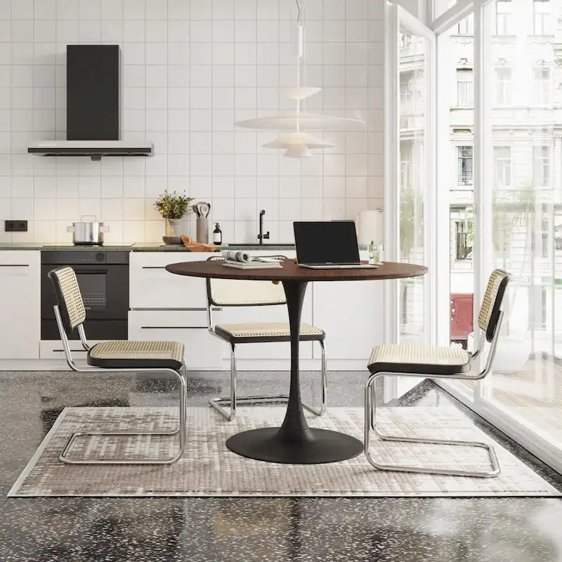 Tavolo da pranzo rotondo moderno con base in metallo