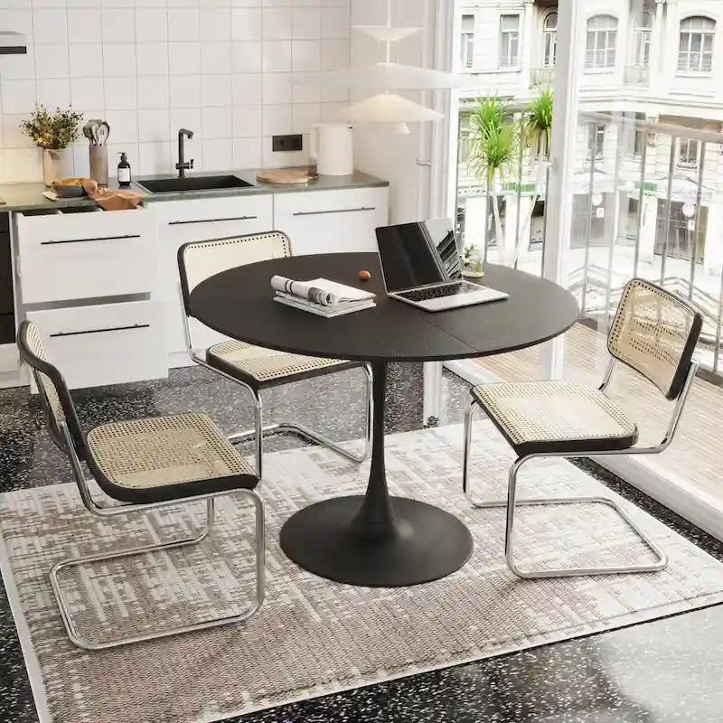 Tavolo da pranzo rotondo moderno con base in metallo