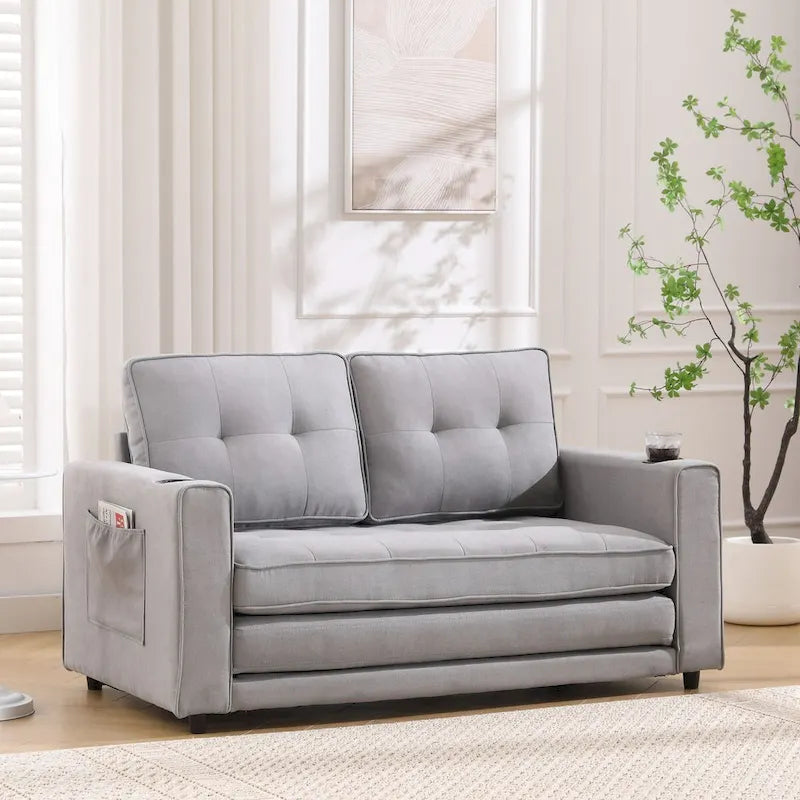 Divano futon imbottito con letto estraibile, divanetto capitonné pieghevole disponibile in vari colori, con portabicchieri