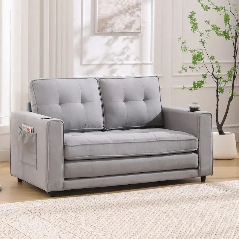 Divano futon imbottito con letto estraibile, divanetto capitonné pieghevole disponibile in vari colori, con portabicchieri