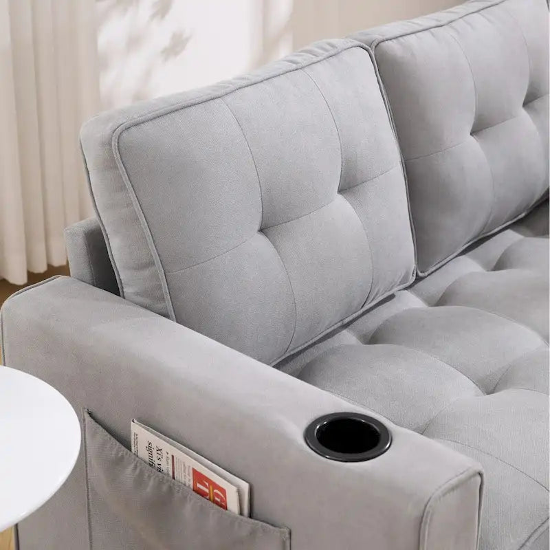 Divano futon imbottito con letto estraibile, divanetto capitonné pieghevole disponibile in vari colori, con portabicchieri